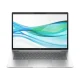 Silver HP laptop open from front view with green and blue wave wallpaper on screen.